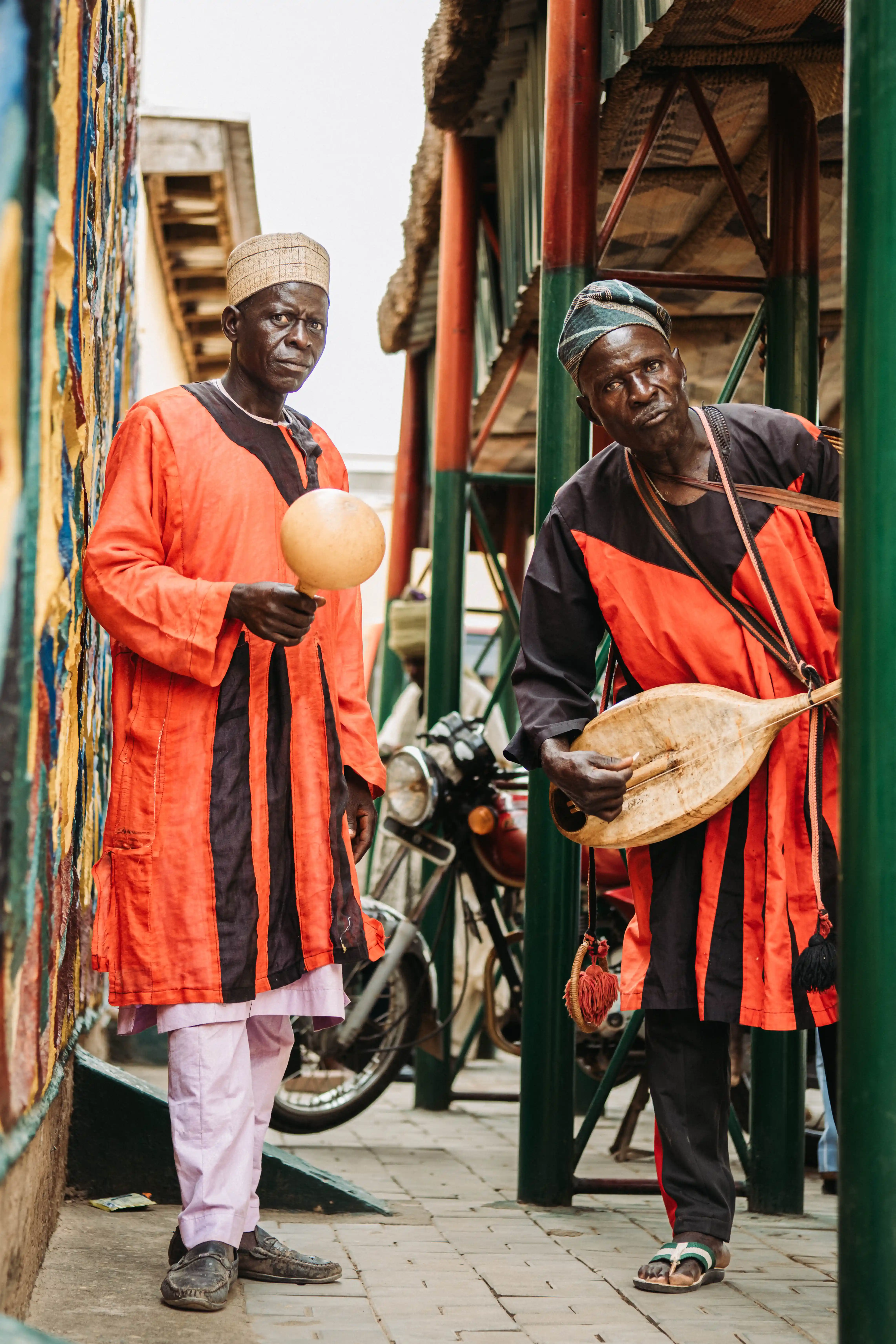 Guard arranging vibrant saddle fabrics before the parade